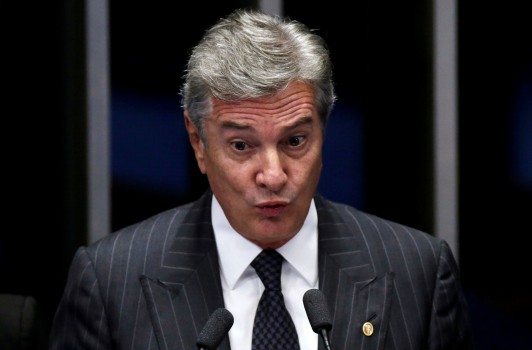 Senator Fernando Collor de Mello speaks during a vote session on the impeachment of President Dilma Rousseff in Brasilia, Brazil, May 11, 2016. REUTERS/Ueslei Marcelino
