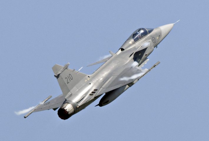 A Saab JAS 39C Gripen jet performs during an aerial show in Eslov in this June 5, 2011 file photo. Brazil on December 18, 2013 awarded a $4.5 billion contract to Saab AB to replace its aging fleet of fighter jets, a surprise coup for the Swedish company after news of U.S. spying on Brazilians helped derail Boeing's chances for the deal. The contract, negotiated over the course of three consecutive Brazilian presidencies, will supply Brazil's air force with 36 new Gripen NG fighters through 2023. Aside from the cost of the jets themselves, the agreement is also expected to generate billions of additional dollars in future supply and service contracts. REUTERS/Johan Nilsson/TT News Agency/Files (SWEDEN - Tags: TRANSPORT MILITARY BUSINESS) ATTENTION EDITORS - THIS IMAGE HAS BEEN SUPPLIED BY A THIRD PARTY. IT IS DISTRIBUTED, EXACTLY AS RECEIVED BY REUTERS, AS A SERVICE TO CLIENTS. SWEDEN OUT. NO COMMERCIAL OR EDITORIAL SALES IN SWEDEN