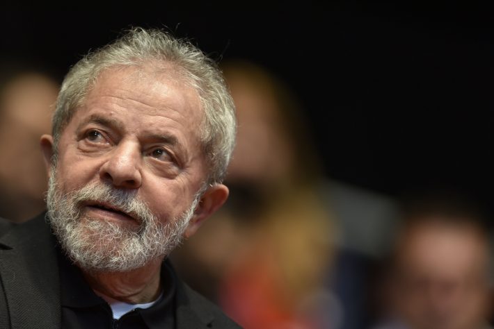 (FILES) This file photo taken on August 29, 2015 shows Brazilian former president (2003-2011) Luiz Inacio Lula Da Silva participating in the 12th Congress of the Brazilian Workers Union (CUT) in Belo Horizonte, Brazil, on August 28, 2015. Brazil police search home on March 4, 2016 of ex-president Lula da Silva in corruption probe. / AFP / DOUGLAS MAGNO